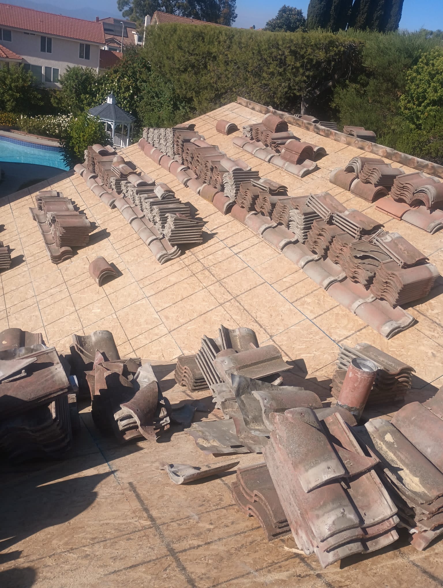 Clay tiles stacked on OSB roof deck