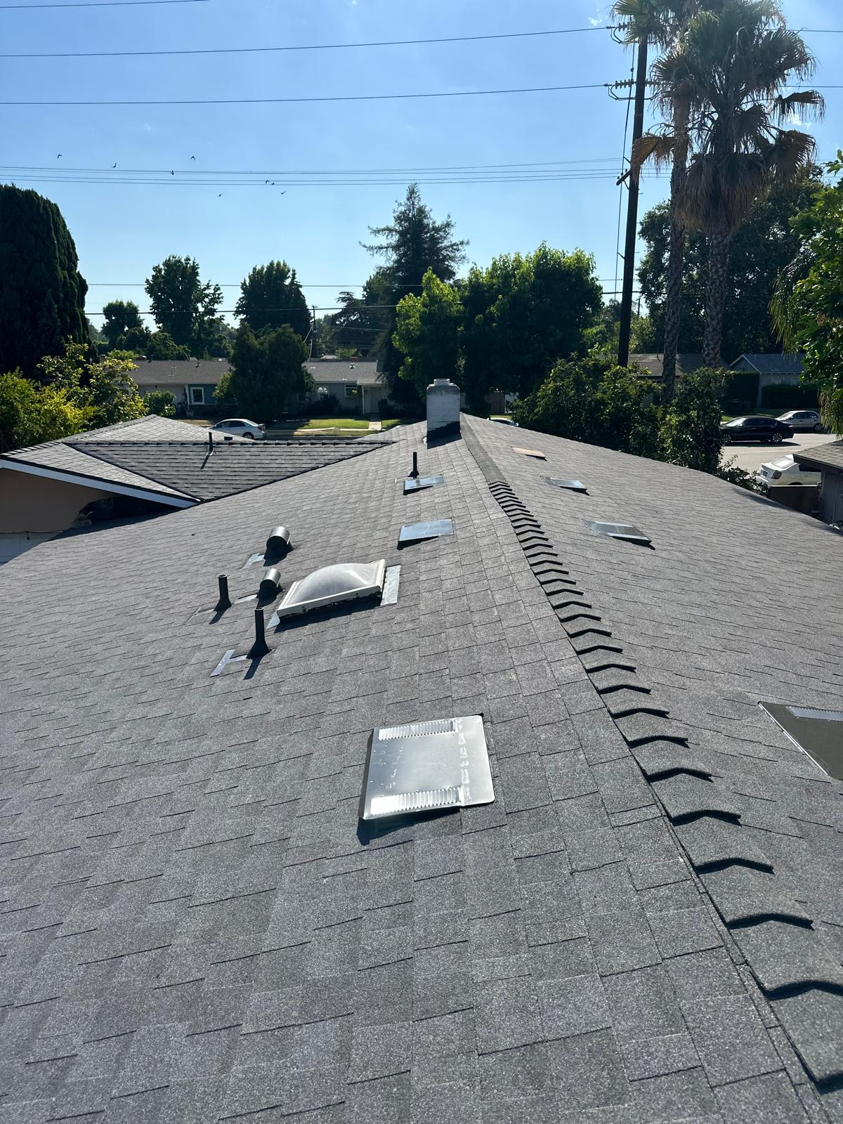 Completed dark gray asphalt shingle roof